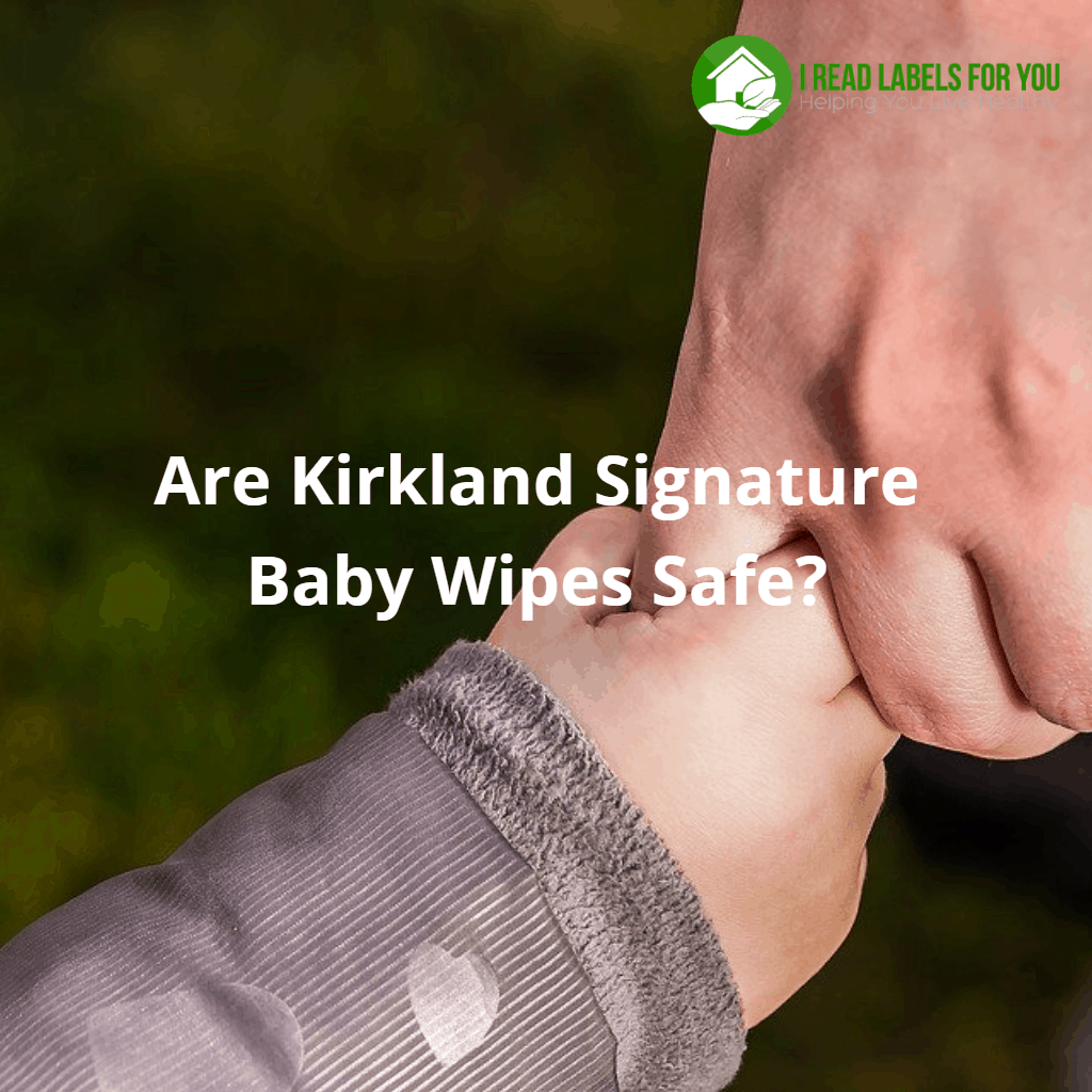 Are Kirkland Signature Baby Wipes Safe? A photo of a baby hand held by an adult hand.