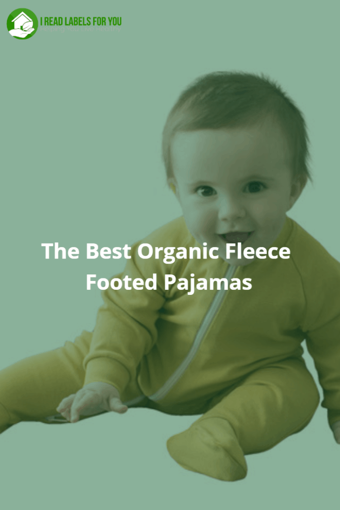 The Best Organic Fleece Footed Pajamas. A photo of a happy sitting baby dressed in yellow footed pajamas with a zipper.