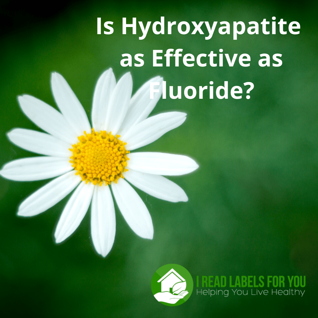 Is Hydroxyapatite as Effective as Fluoride in toothpaste. A picture of a daisy on the green background.