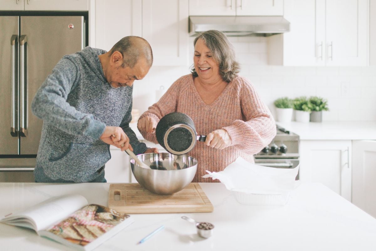 A photo of a couple potentially cooking with GreenPan cookware.