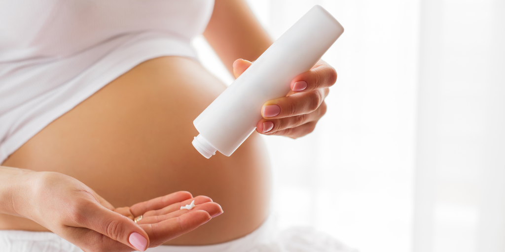 a photo of a woman with a skin cream bottle.