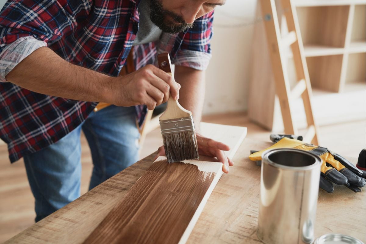 Man applying varnish