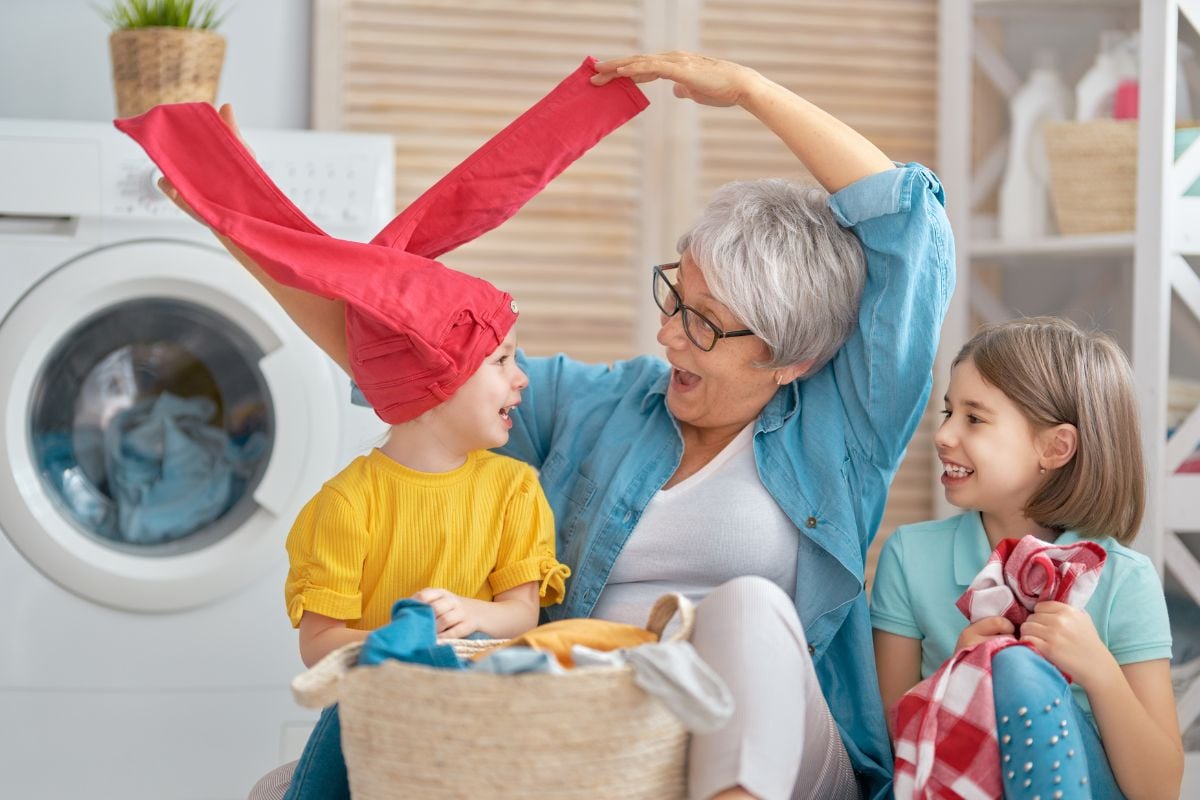 A photo of a grandmother and her grandkids goofing around.